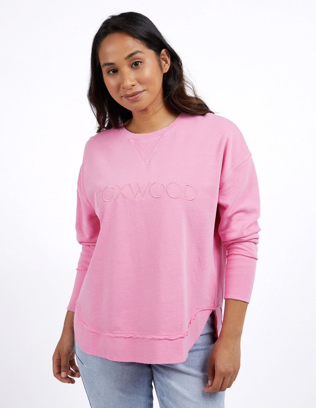 Woman wearing a pink sweater and light blue jeans on a white background
Simplified Crew Bubblegum Pink