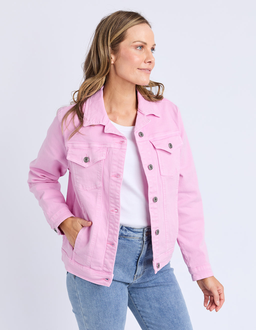 Woman wearing a pink denim jacket and blue jeans on a white background
Tilly Denim Jacket Dusk Pink