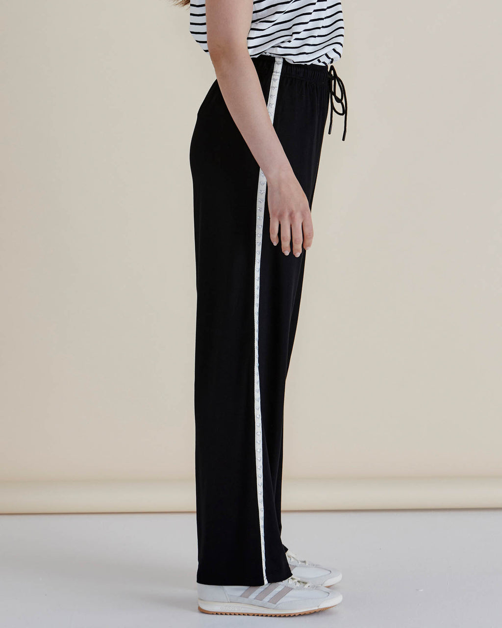 Woman wearing a striped shirt and black pants against a plain background
Evelyn Wide Leg Jogger Black