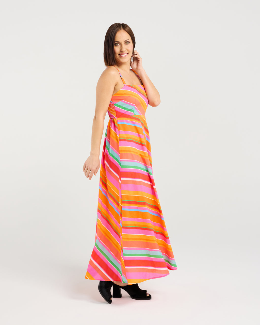 Woman wearing a colorful striped dress on a white background
Clementine Dress Dynamic Stripe