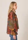 Woman wearing a patterned blouse with a neutral background
Bohemian Top Nouveau Floral Green