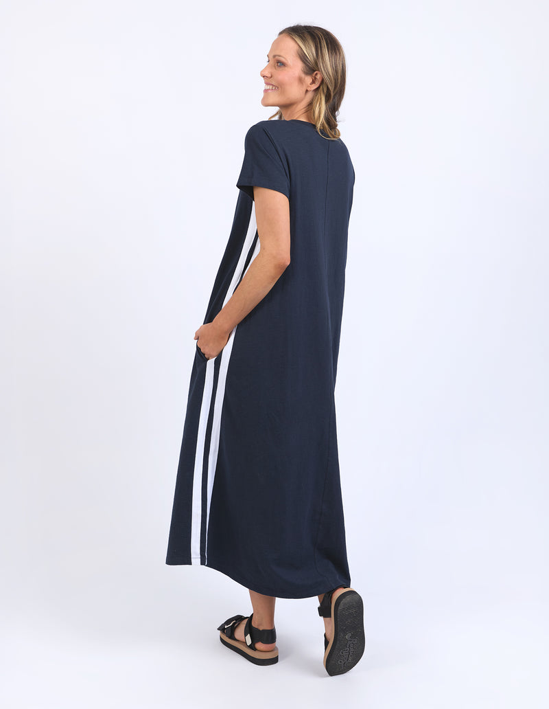 Woman wearing a navy dress with white stripes on a white background
Recovery Dress Navy
