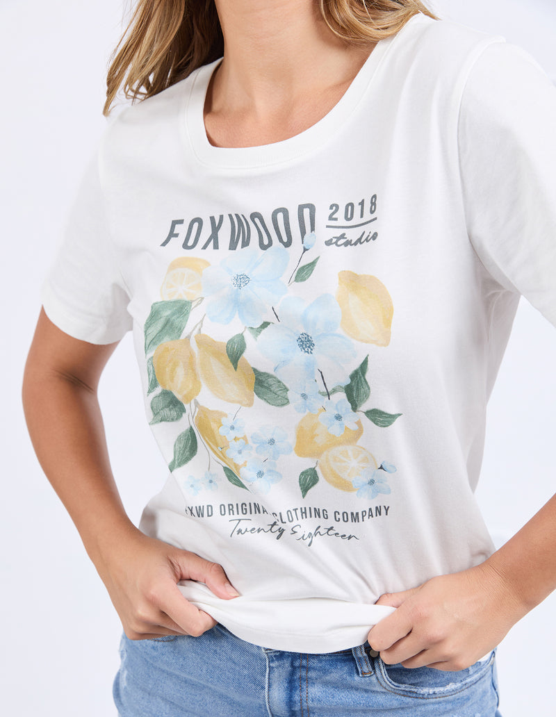 White t-shirt with lemon and floral design and text on a white background
Limoncello Tee Vintage White