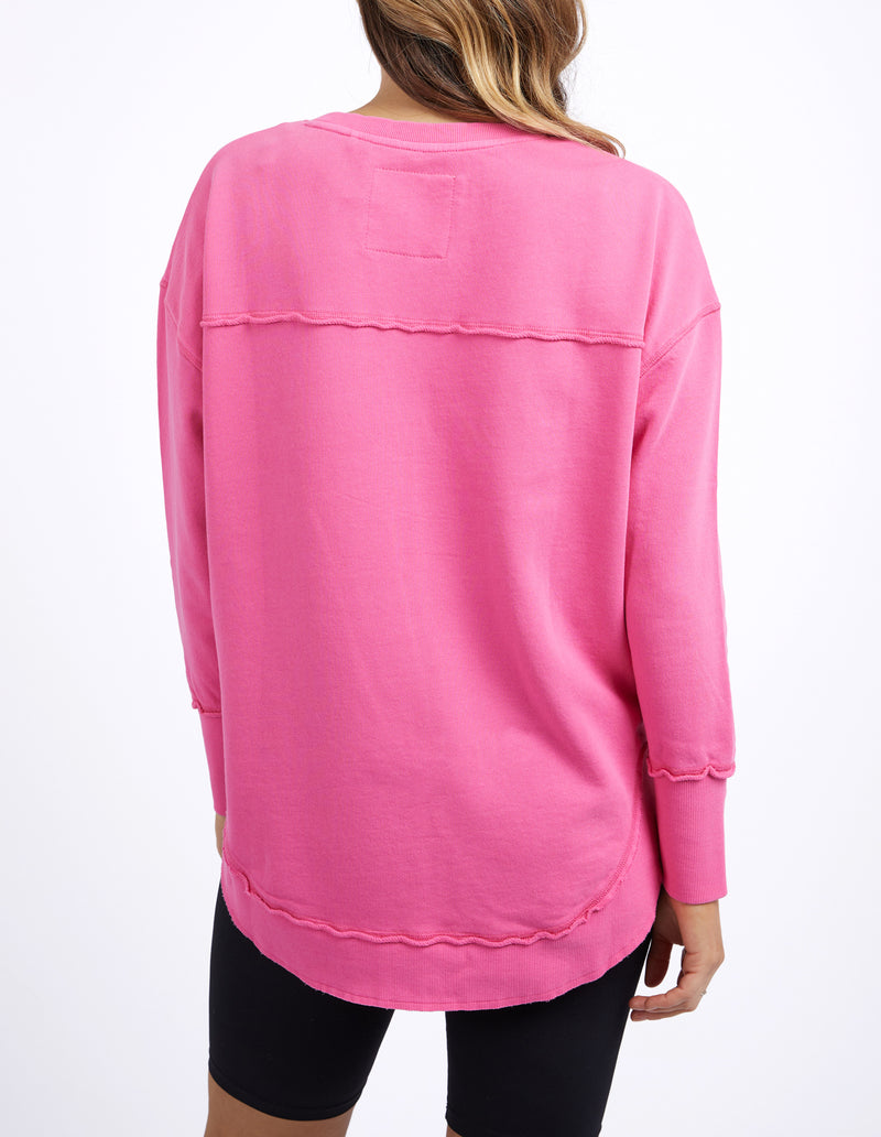 Pink long-sleeve top worn by a person on a white background
Simplified Crew Bright Pink