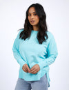 Woman wearing a light blue sweater on a white background
Simplified Crew Light Blue