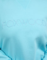 Light blue sweatshirt with 'FOXWOOD' branding on a light blue background
Simplified Crew Light Blue