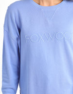 Light blue sweatshirt with 'FOXWOOD' text on a plain background
Simplified Crew Neon Blue