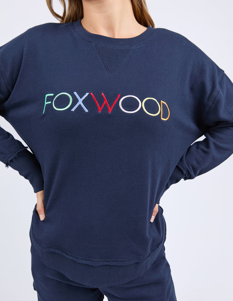 Navy sweatshirt with 'FOXWOOD' in multicolor on a white background
Simplified Confetti Crew Navy