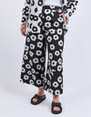 Person wearing black floral-patterned pants on a white background
Azalea Pants Navy