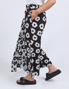 Person wearing black and white floral pants on a white background
Azalea Pants Navy