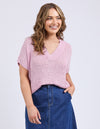 Woman wearing a pink knitted top and blue jeans on a light purple background
Elba Knit Top Dusk Pink