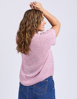 Woman wearing a pink knitted top and blue jeans on a light gray background
Elba Knit Top Dusk Pink