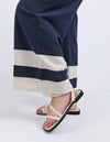 Person wearing navy and white striped pants with beige sandals on a white background
Scarlet Pants Navy