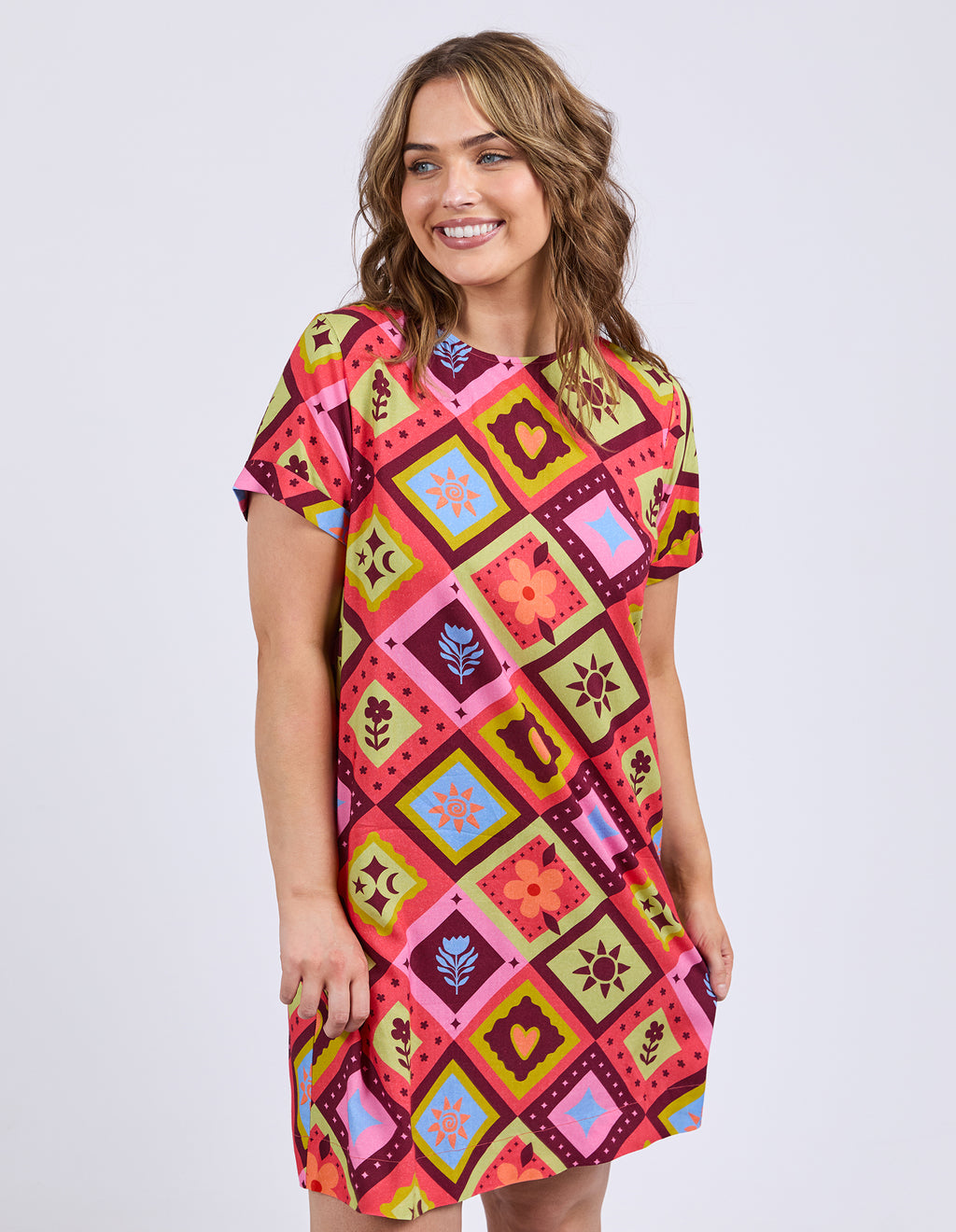 Woman wearing a colorful patterned dress on a white background
Rhode Dress Geo Print