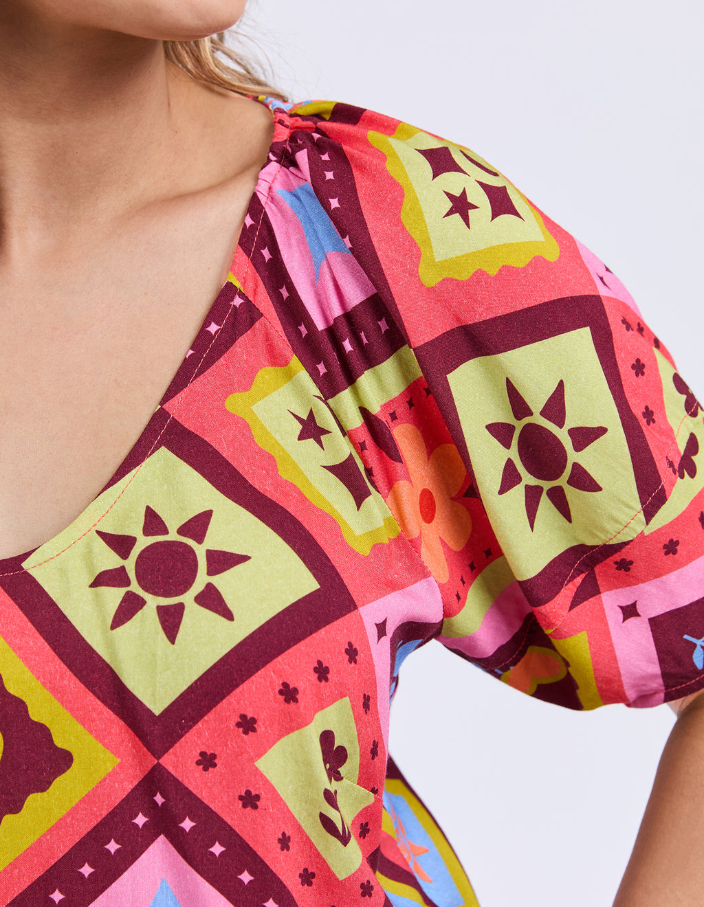 Colorful patterned top with geometric design on a white background
Rhode Top Geo Print