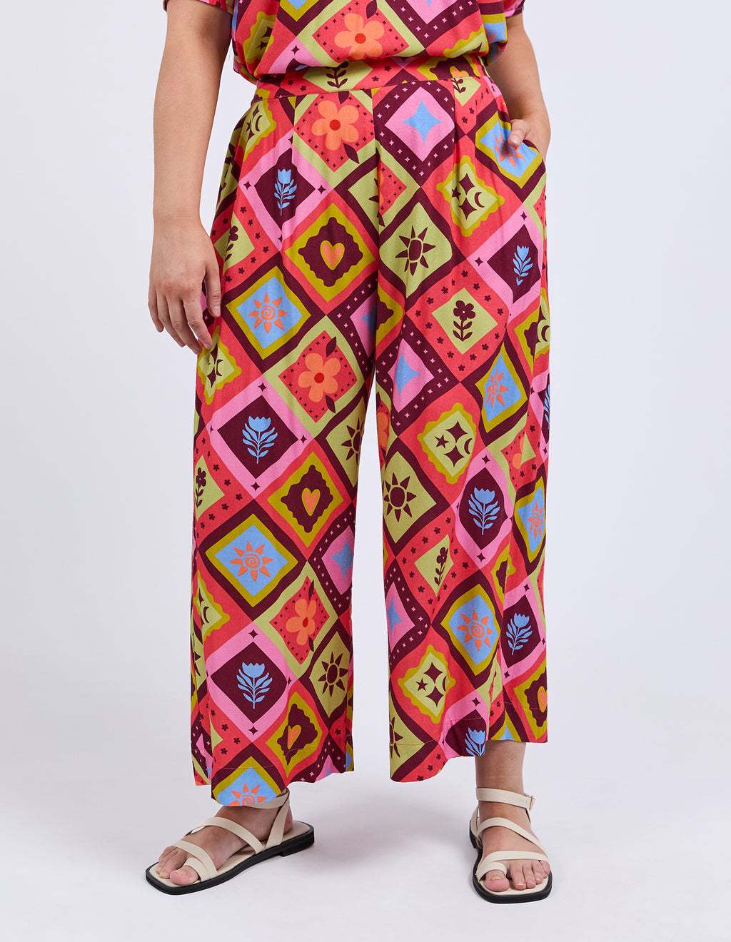 Person wearing colorful patterned pants on a white background
Rhode Pants Geo Print