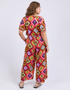 Woman wearing a colorful patterned dress on a white background
Rhode Pants Geo Print