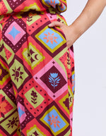 Colorful patterned fabric with geometric designs on a plain background
Rhode Pants Geo Print