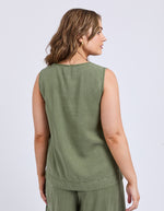 Woman wearing a green sleeveless top and pants on a light gray background
Bliss Tank Clover