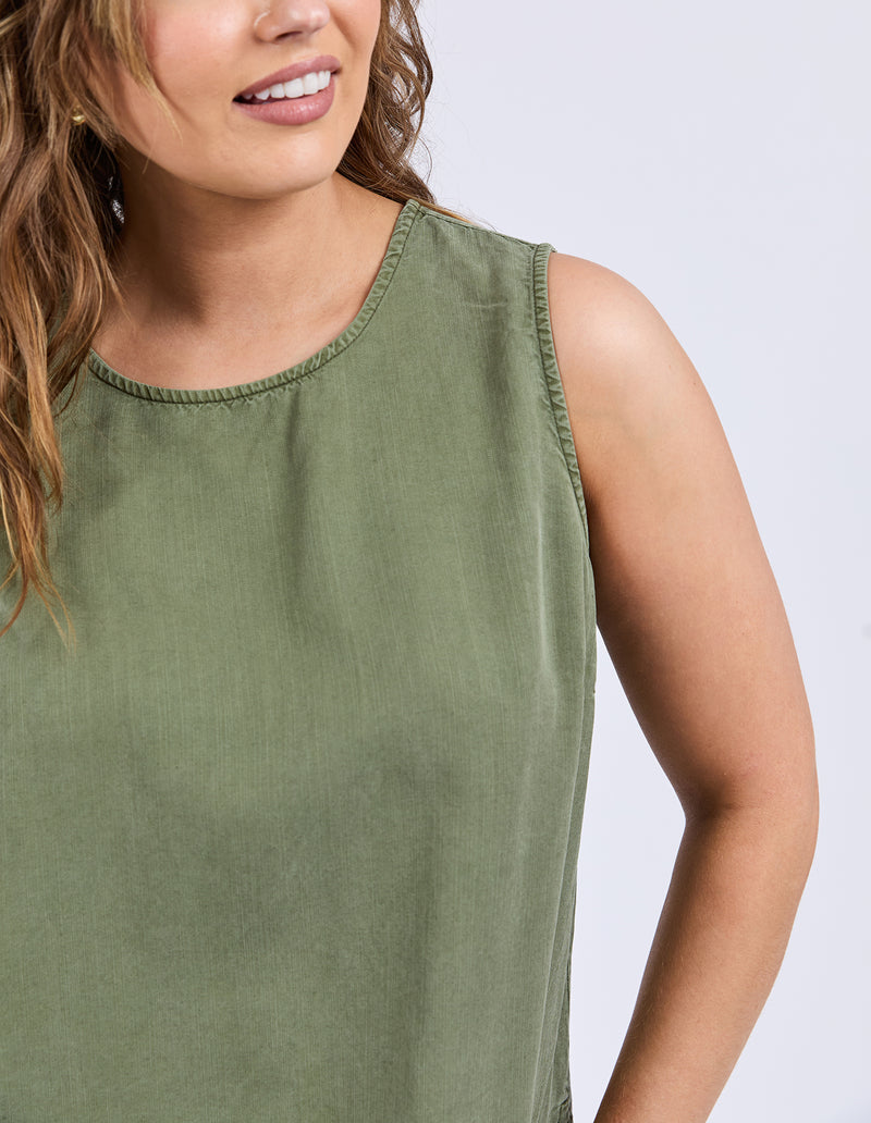 Woman wearing a green sleeveless top against a white background
Bliss Tank Clover