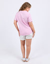 Woman wearing a pink t-shirt and white shorts on a light gray background
Winona Tee Dusk Pink