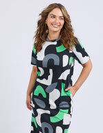 Woman wearing a patterned dress with abstract shapes on a plain background
Stijl Dress Charcoal