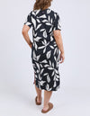 Woman wearing a black dress with white floral pattern on a white background
Mimosa Tee Dress Black