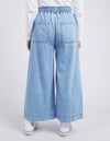 Light blue wide-leg jeans worn by a person on a white background
Greta Wide Leg Pant Blue