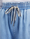 Close-up of a blue denim skirt with a drawstring waistband.
Greta Wide Leg Pant Blue