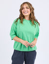 Woman wearing a green top and navy pants on a white background
Mazie Sweat Spring Green