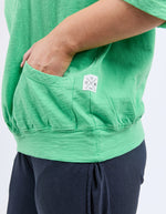 Green shirt with a small white logo on a plain background
Mazie Sweat Spring Green