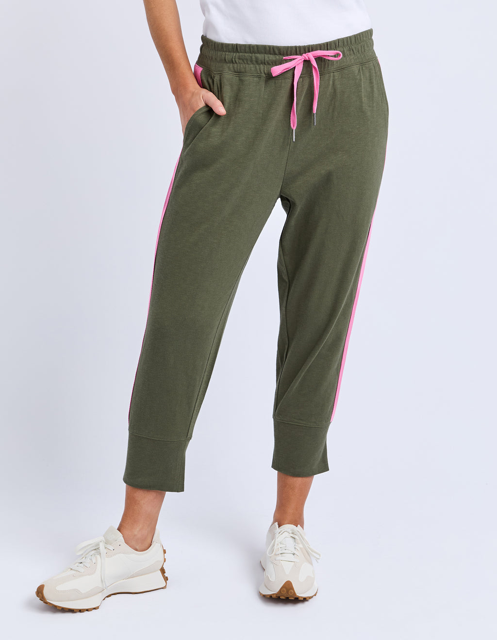 Green jogger pants with pink stripes worn by a person on a white background
Brunch Pants Clover Green