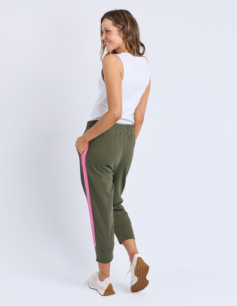 Woman wearing green jogger pants with a pink stripe on a white background
Brunch Pants Clover Green