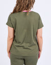 Person wearing an olive green t-shirt and pants on a white background
Cooper Tee Clover Green
