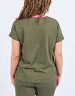 Person wearing an olive green t-shirt and pants on a white background
Cooper Tee Clover Green