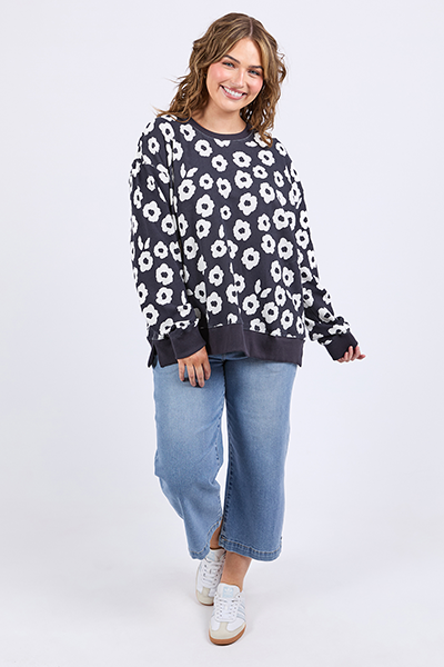 Woman wearing a floral sweater and jeans on a white background
Azalea Crew Navy