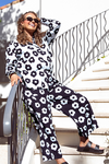 Woman wearing a black and white patterned outfit standing on a staircase.
Azalea Pants Navy