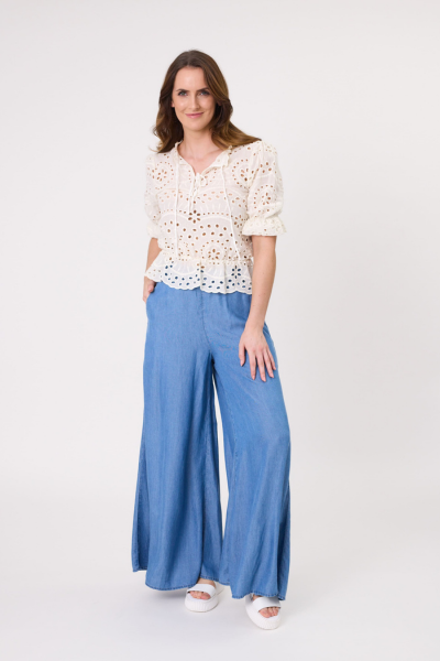 Woman wearing a white lace top and blue wide-leg pants on a white background
Azzura Pant Chambray