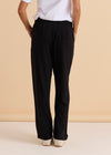 Person wearing black pants and a white shirt against a beige background
Ginnie Bamboo Pant Black