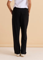 Person wearing black pants and a white shirt against a beige background
Ginnie Bamboo Pant Black