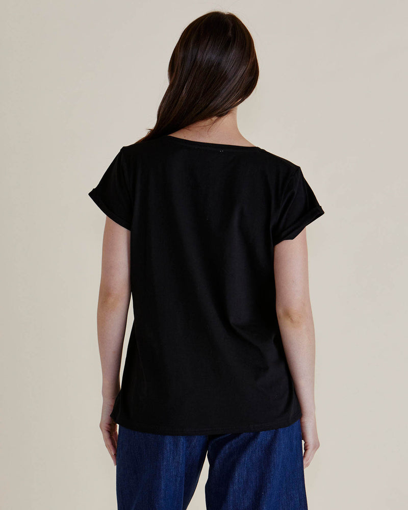 Person wearing a black t-shirt and blue pants on a beige background
Ayla V-Neck Tee Black
