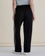Person wearing black pants with a white stripe on a beige background
Evelyn Wide Leg Jogger Black