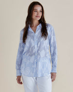 Woman wearing a light blue floral patterned shirt against a beige background
Lace Stripe Shirt Blue