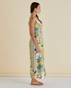 Woman wearing a colorful patterned dress against a beige background Tegan Midi Dress Paradise Print