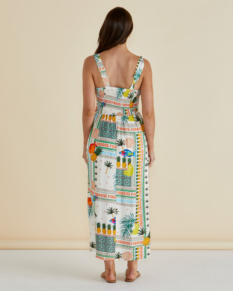 Woman wearing a colorful tropical print dress with a beige background Tegan Midi Dress Paradise Print