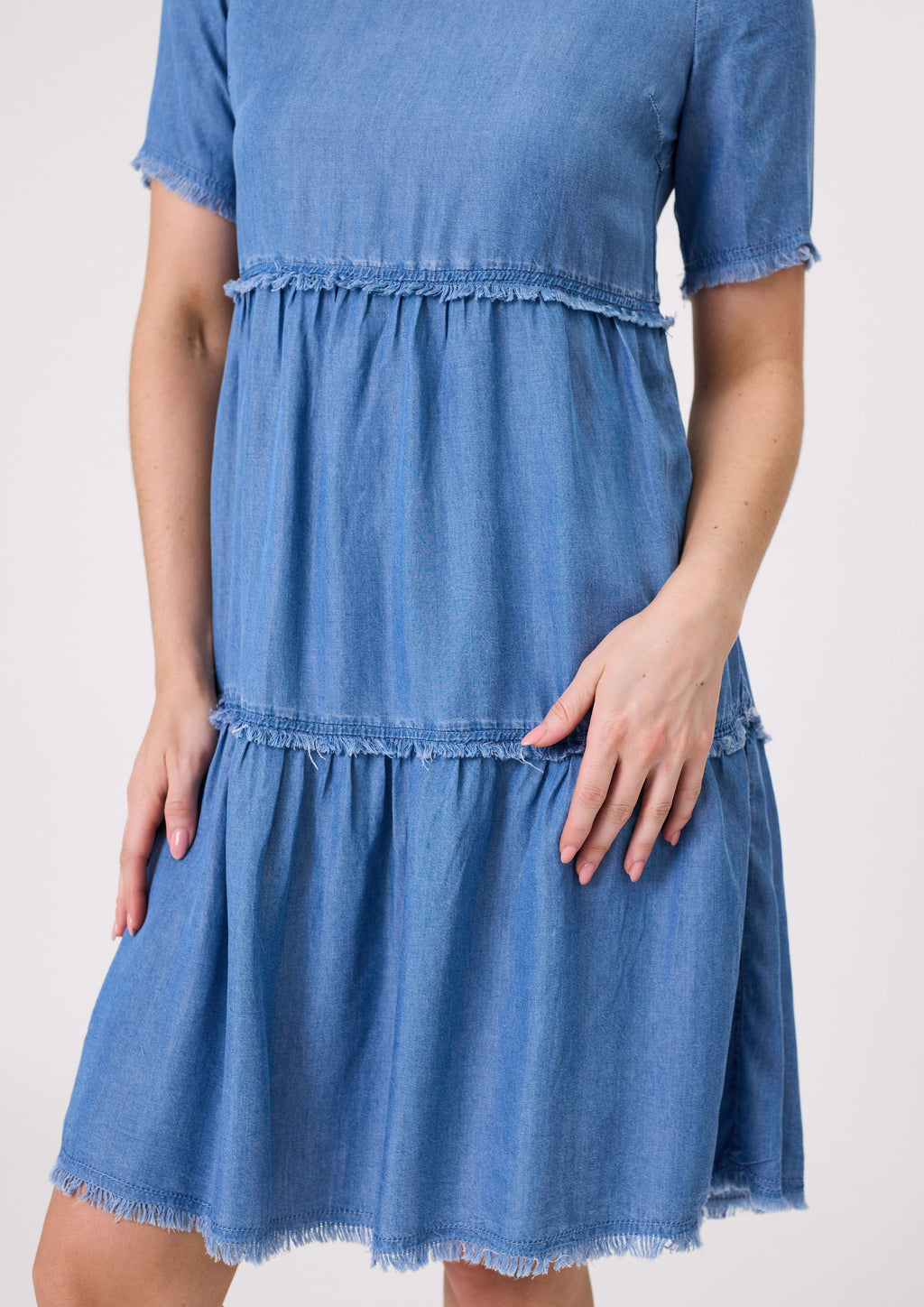 Blue denim dress worn by a person on a white background
Beatrice Dress Chambray