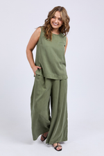 Woman wearing a green sleeveless top and wide-leg pants on a white background
Bliss Tank Clover