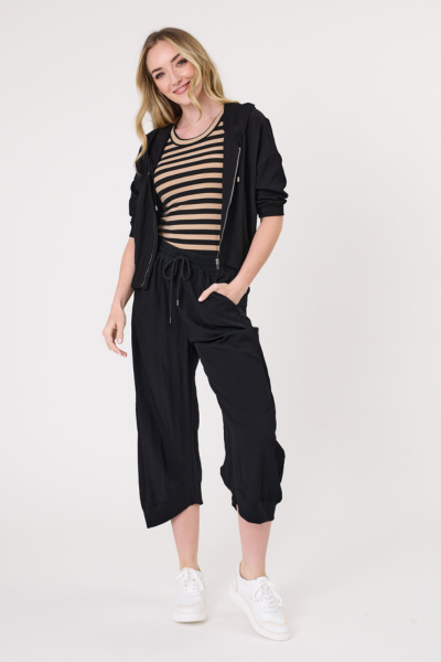 Woman wearing a black outfit with a striped top on a white background
Bria Jacket Black