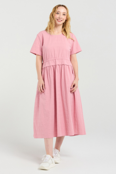 Woman wearing a pink dress on a white background Brodie Dress Pink