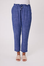 Blue checkered pants worn by a person on a white background Venice Linen Pant Denim